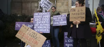 A protestor holds a banner reads: "Shame changes side", during a protest outside the Vannes courthouse, western France, on the opening day of the trial of French surgeon Joel Le Scouarnec accused of raping or abusing 299 people, mostly child patients, Monday, Feb. 24, 2025. (AP Photo/Thomas Padilla)