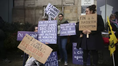 A protestor holds a banner reads: "Shame changes side", during a protest outside the Vannes courthouse, western France, on the opening day of the trial of French surgeon Joel Le Scouarnec accused of raping or abusing 299 people, mostly child patients, Monday, Feb. 24, 2025. (AP Photo/Thomas Padilla)