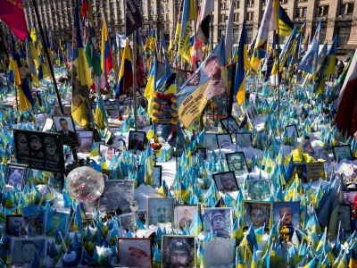 Tributes are placed during the memorial for the fallen at Independence Square Maidan on the third anniversary of Russia's invasion of Ukraine, in Kyiv, Ukraine February 24, 2025. Ritzau Scanpix/Bo Amstrup/via REUTERS  ATTENTION EDITORS - THIS IMAGE WAS PROVIDED BY A THIRD PARTY. DENMARK OUT. NO COMMERCIAL OR EDITORIAL SALES IN DENMARK.