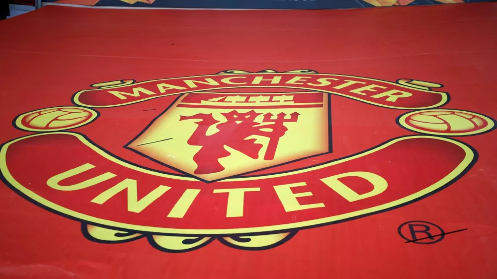 FILE PHOTO: Soccer Football - Europa League - Round of 16 First Leg - Manchester United v AC Milan - Old Trafford, Manchester, Britain - March 11, 2021 General view of the crest of Manchester United inside the stadium before the match REUTERS/Phil Noble/File Photo