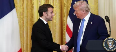 U.S. President Donald Trump and French President Emmanuel Macron shake hands during a press conference, at the White House in Washington, D.C., U.S., February 24, 2025. REUTERS/Evelyn Hockstein   TPX IMAGES OF THE DAY