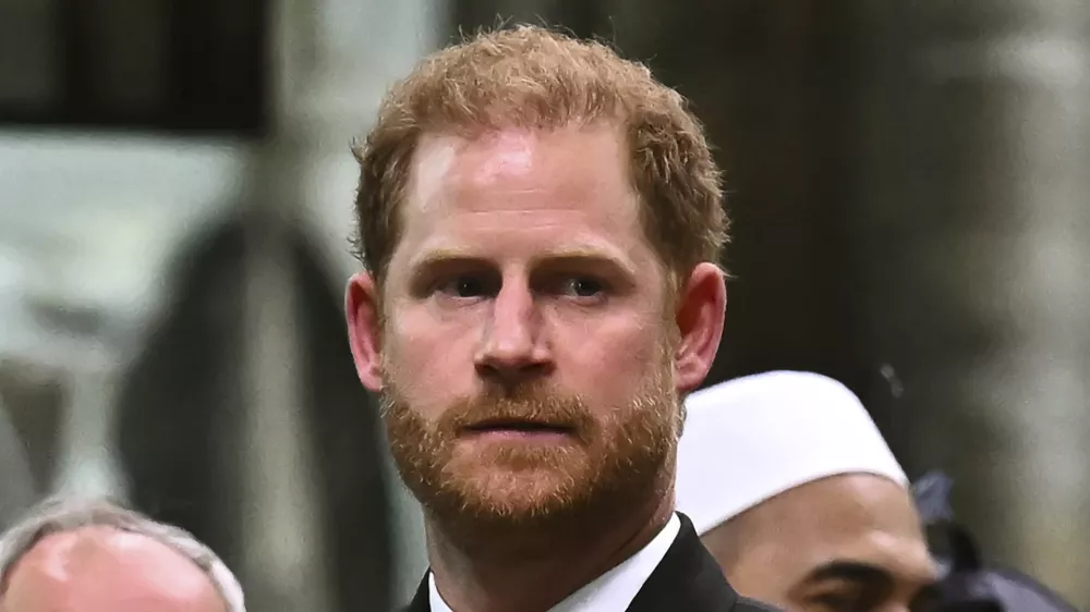 FILE - Britain's Prince Harry, Duke of Sussex looks on as Britain's King Charles III leaves Westminster Abbey after coronation in central London Saturday, May 6, 2023. Prince Harry has spoken to King Charles III about his cancer diagnosis and "will be traveling to the U.K. to see His Majesty in the coming days," said the office of Harry and his wife, Meghan. (Ben Stansall/Pool photo via AP, File)