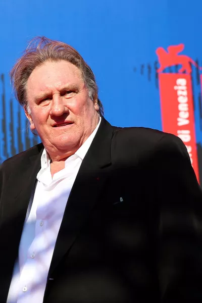 FILE PHOTO: Gerard Depardieu waves as he arrives during a red carpet event for the movie "Novecento- Atto Primo" at the 74th Venice Film Festival in Venice, Italy, Italy September 5, 2017.  REUTERS/Alessandro Bianchi/File Photo