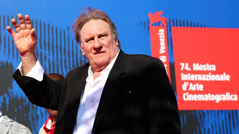 FILE PHOTO: Gerard Depardieu waves as he arrives during a red carpet event for the movie "Novecento- Atto Primo" at the 74th Venice Film Festival in Venice, Italy, Italy September 5, 2017.  REUTERS/Alessandro Bianchi/File Photo