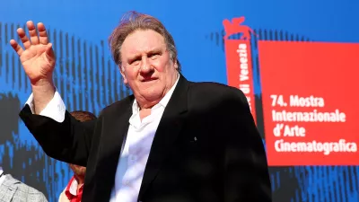 FILE PHOTO: Gerard Depardieu waves as he arrives during a red carpet event for the movie "Novecento- Atto Primo" at the 74th Venice Film Festival in Venice, Italy, Italy September 5, 2017.  REUTERS/Alessandro Bianchi/File Photo