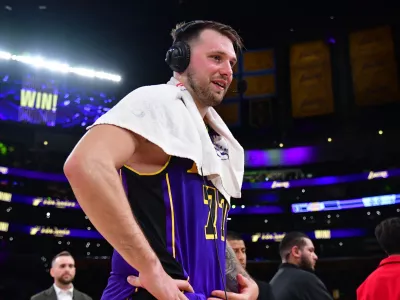 Feb 25, 2025; Los Angeles, California, USA; Los Angeles Lakers guard Luka Doncic (77) speaks to the media after the game against the Dallas Mavericks reacts at Crypto.com Arena. Mandatory Credit: Gary A. Vasquez-Imagn Images