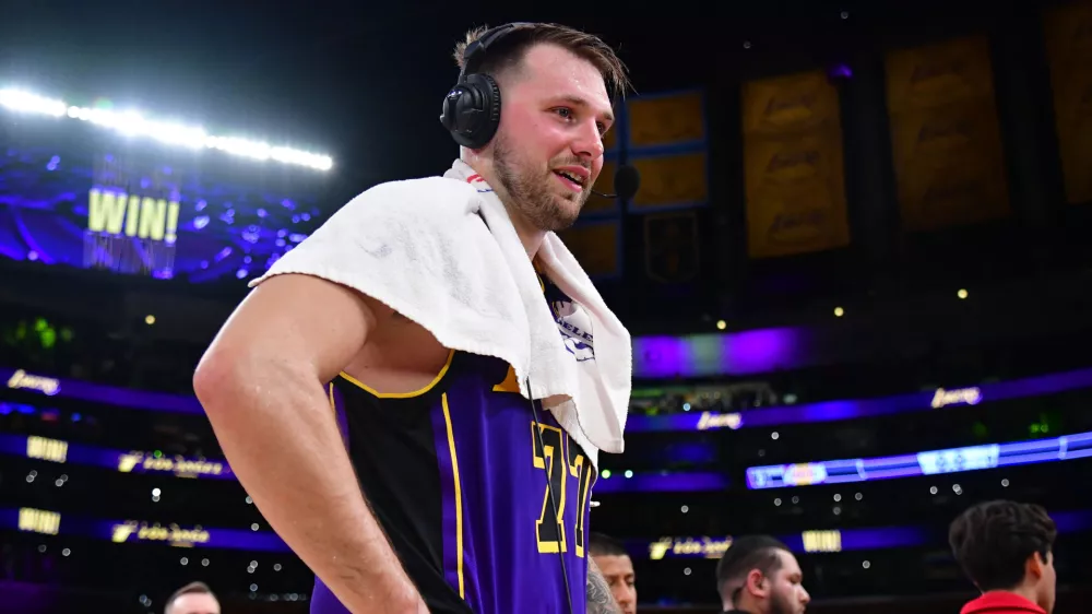 Feb 25, 2025; Los Angeles, California, USA; Los Angeles Lakers guard Luka Doncic (77) speaks to the media after the game against the Dallas Mavericks reacts at Crypto.com Arena. Mandatory Credit: Gary A. Vasquez-Imagn Images