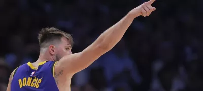 Los Angeles Lakers guard Luka Doncic reacts during the second half of an NBA basketball game against the Dallas Mavericks, Tuesday, Feb. 25, 2025, in Los Angeles. (AP Photo/Mark J. Terrill)