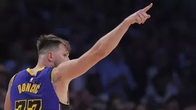 Los Angeles Lakers guard Luka Doncic reacts during the second half of an NBA basketball game against the Dallas Mavericks, Tuesday, Feb. 25, 2025, in Los Angeles. (AP Photo/Mark J. Terrill)