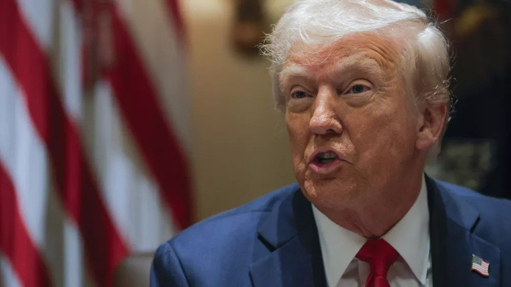 President Donald Trump speaks during a Cabinet meeting at the White House in Washington, Tuesday, Feb. 26, 2025. (Pool via AP)