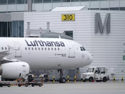 A Lufthansa aircraft stands at a gate at the Munich Airport in Munich, Germany, Thursday, Feb 27, 2025. (Sven Hoppe/dpa via AP)