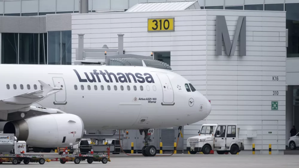 A Lufthansa aircraft stands at a gate at the Munich Airport in Munich, Germany, Thursday, Feb 27, 2025. (Sven Hoppe/dpa via AP)