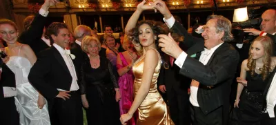 Karima el-Mahroug nicknamed Ruby and her host Austrian businessman Richard Lugner, from left, enjoy a dance during the traditional Opera Ball in front of the state opera in Vienna, Austria on Thursday, March 3, 2011. (AP Photo/Ronald Zak)