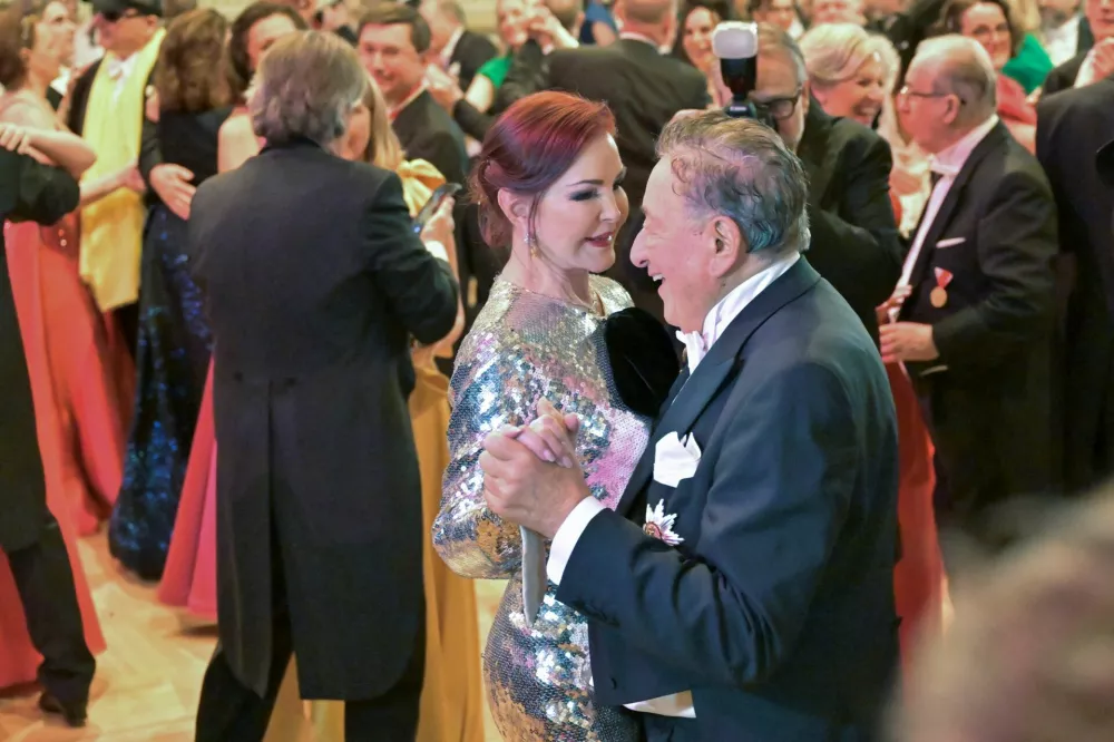 Priscilla Presley and Austrian entrepreneur Richard Lugner dance during the opening ceremony of the traditional Opera Ball in Vienna, Austria, February 8, 2024. REUTERS/Elisabeth Mandl