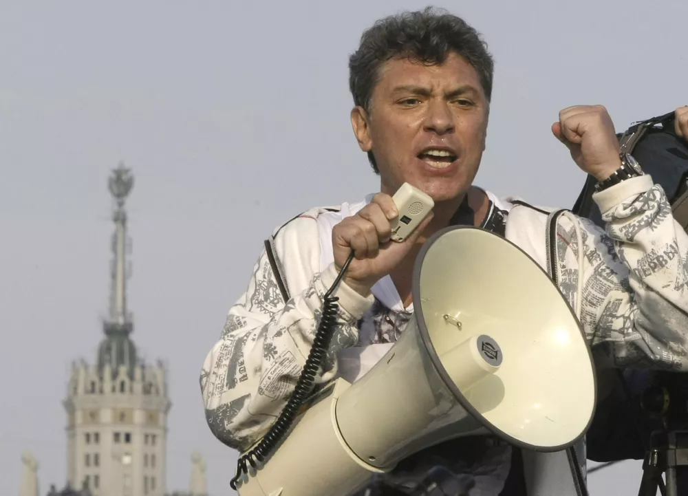 ﻿FILE - In this file photo taken on Sunday, May 6, 2012, Opposition leader Boris Nemtsov uses a loud speaker during an opposition rally in downtown Moscow, Russia. Russia's Interior Ministry says Boris Nemtsov, a leading opposition figure and former deputy prime minister, has been shot and killed near the Kremlin. Nemtsov, a sharp critic of President Vladimir Putin, was killed early Saturday. His death comes just a day before a major opposition rally in Moscow. (AP Photo/Misha Japaridze, File)