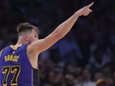 Los Angeles Lakers guard Luka Doncic reacts during the second half of an NBA basketball game against the Dallas Mavericks, Tuesday, Feb. 25, 2025, in Los Angeles. (AP Photo/Mark J. Terrill)