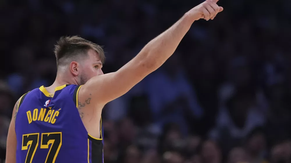 Los Angeles Lakers guard Luka Doncic reacts during the second half of an NBA basketball game against the Dallas Mavericks, Tuesday, Feb. 25, 2025, in Los Angeles. (AP Photo/Mark J. Terrill)