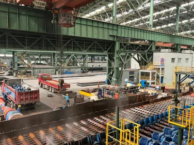 FILE PHOTO: Employees work on the production line at a Baowu Group steel mill in Ezhou, Hubei province, China June 21, 2023. REUTERS/Amy Lv/File Photo