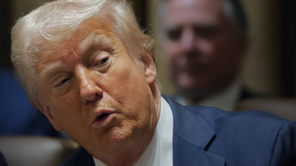 President Donald Trump speaks during a Cabinet meeting at the White House in Washington, Wednesday, Feb. 26, 2025. (Pool via AP)