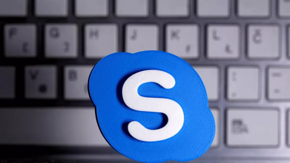 FILE PHOTO: A 3D printed Skype logo is placed in front of a keyboard in this illustration taken April 12, 2020. REUTERS/Dado Ruvic/Illustration/File Photo