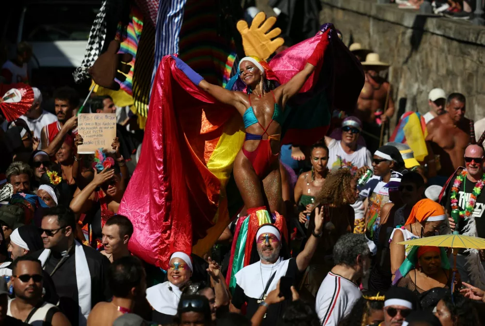 Revelers take part in the annual block party known as "Carmelitas", during Carnival festivities in Rio de Janeiro, Brazil, February 28, 2025. REUTERS/Pilar Olivares