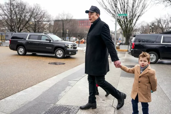 FILE PHOTO: Elon Musk walks with his son X Æ A-12, on the day he met with Indian Prime Minister Narendra Modi at Blair House, in Washington, D.C., U.S., February 13, 2025. REUTERS/Nathan Howard/File Photo