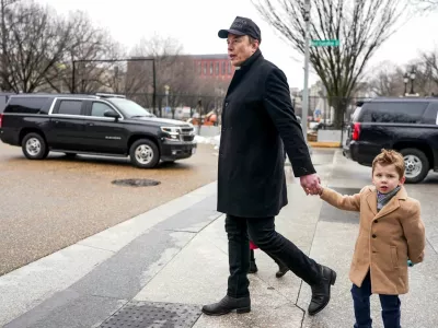 FILE PHOTO: Elon Musk walks with his son X Æ A-12, on the day he met with Indian Prime Minister Narendra Modi at Blair House, in Washington, D.C., U.S., February 13, 2025. REUTERS/Nathan Howard/File Photo