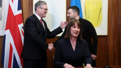 Britain's Chancellor of the Exchequer Rachel Reeves sit on the day she holds a video conference meeting with Ukraine's Finance Minister Sergii Marchenko, as British Prime Minister Keir Starmer and Ukrainian President Volodymyr Zelenskiy shake hands in London, Britain, March 1, 2025. REUTERS/Toby Melville/Pool