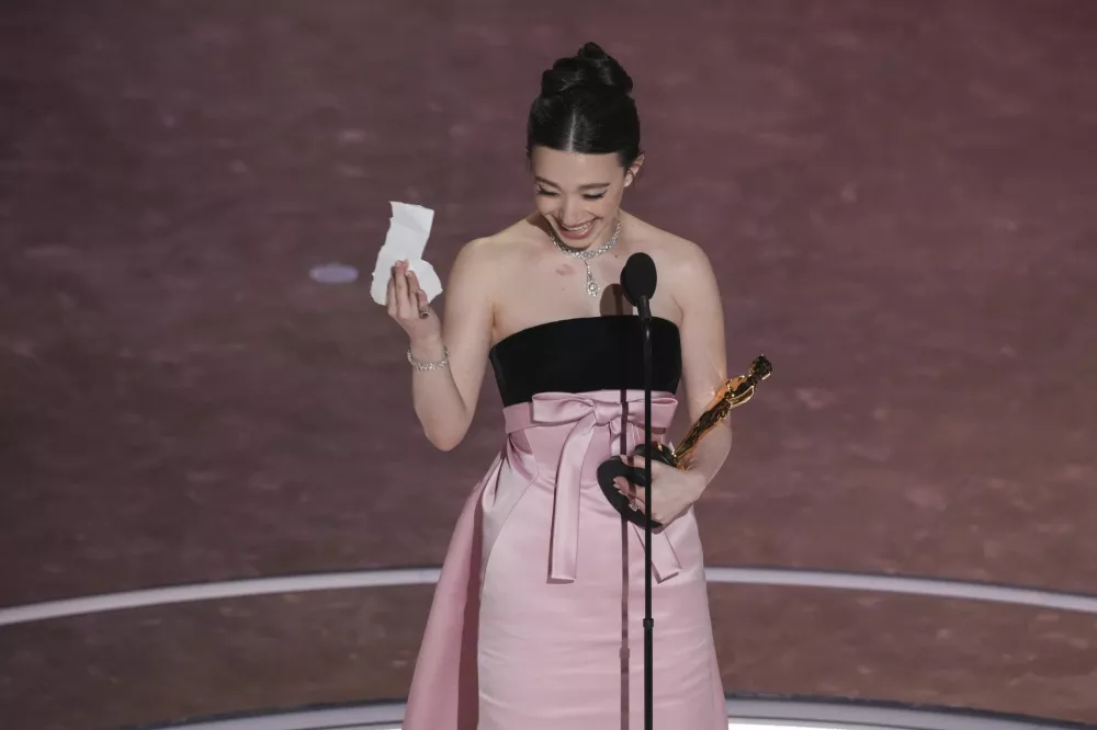 Mikey Madison accepts the award for best performance by an actress in a leading role for "Anora" during the Oscars on Sunday, March 2, 2025, at the Dolby Theatre in Los Angeles. (AP Photo/Chris Pizzello)