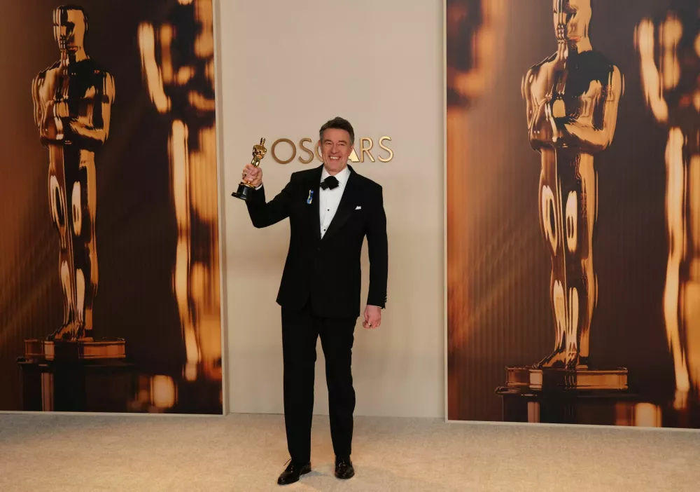 Peter Straughan poses with the Best Adapted Screenplay for "Conclave" award in the Oscars photo room at the 97th Academy Awards in Hollywood, Los Angeles, California, U.S., March 2, 2025. REUTERS/Daniel Cole