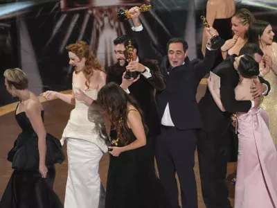 Daria Ekamasova, from left, Lindsey Normington, Samantha Quan, Vache Tovmasyan, Karren Karagulian, Alex Coco, and Mikey Madison accept the award for best picture for "Anora" during the Oscars on Sunday, March 2, 2025, at the Dolby Theatre in Los Angeles. (AP Photo/Chris Pizzello)