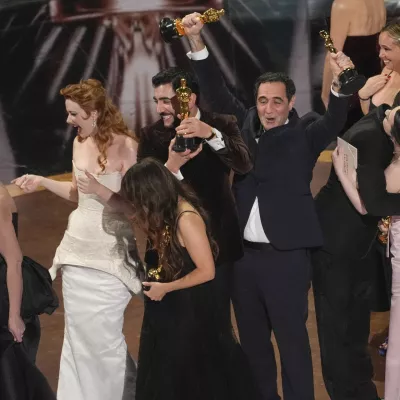 Daria Ekamasova, from left, Lindsey Normington, Samantha Quan, Vache Tovmasyan, Karren Karagulian, Alex Coco, and Mikey Madison accept the award for best picture for "Anora" during the Oscars on Sunday, March 2, 2025, at the Dolby Theatre in Los Angeles. (AP Photo/Chris Pizzello)