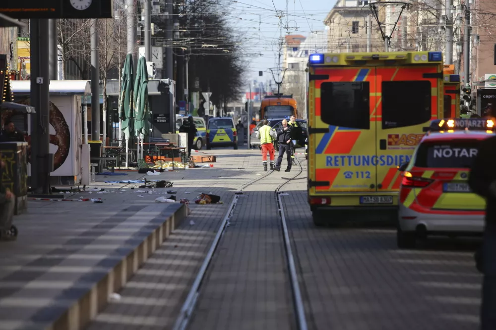 Emergency services and police stand at Paradeplatz in Mannheim, Germany, after a serious incident, Monday March 3, 2025. (Dieter Leder/dpa via AP)