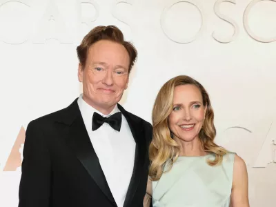 Conan O'Brien and Liza Powel O'Brien pose during the Oscars arrivals at the 97th Academy Awards in Hollywood, Los Angeles, California, U.S., March 2, 2025. REUTERS/Mario Anzuoni