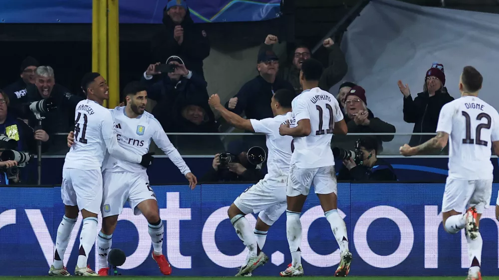 Soccer Football - Champions League - Round of 16 - First Leg - Club Brugge v Aston Villa - Jan Breydel Stadium, Bruges, Belgium - March 4, 2025 Aston Villa's Marco Asensio celebrates scoring their third goal with teammates REUTERS/Yves Herman