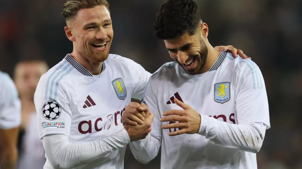 Soccer Football - Champions League - Round of 16 - First Leg - Club Brugge v Aston Villa - Jan Breydel Stadium, Bruges, Belgium - March 4, 2025 Aston Villa's Matty Cash and Aston Villa's Marco Asensio celebrate after the match Action Images via Reuters/Paul Childs