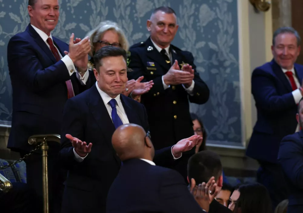 Elon Musk reacts on the day of U.S. President Donald Trump's speech to a joint session of Congress, in the House Chamber of the U.S. Capitol in Washington, D.C., U.S., March 4, 2025. REUTERS/Evelyn Hockstein