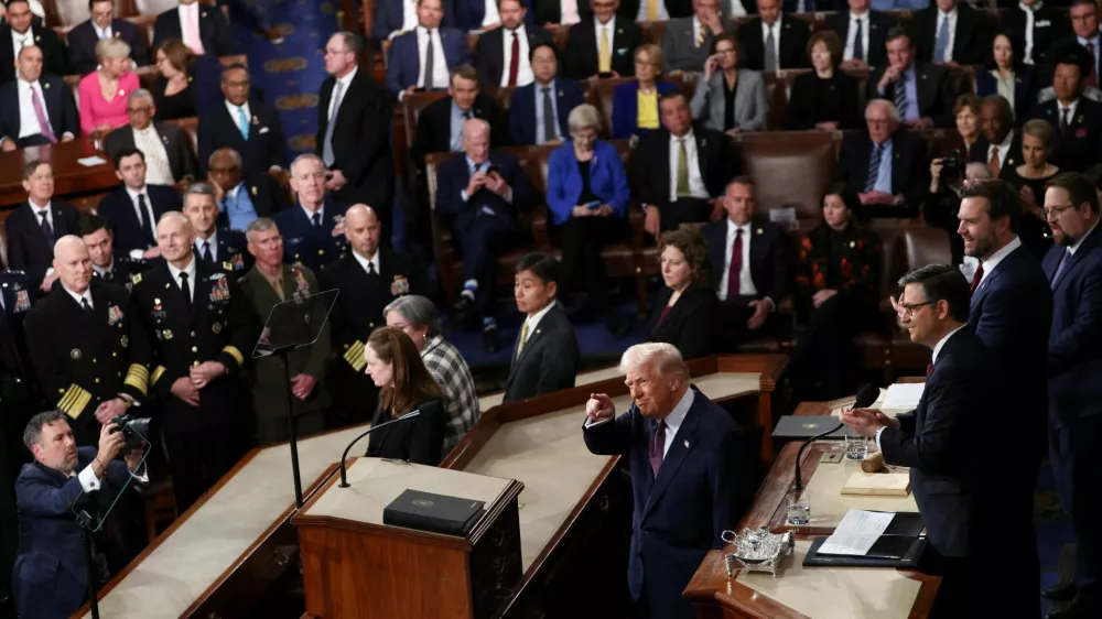 U.S. President Donald Trump, Vice President JD Vance and Speaker of the House Mike Johnson attend a joint session of Congress, in the House Chamber of the U.S. Capitol in Washington, D.C., U.S., March 4, 2025. REUTERS/Evelyn Hockstein. REFILE - QUALITY REPEAT