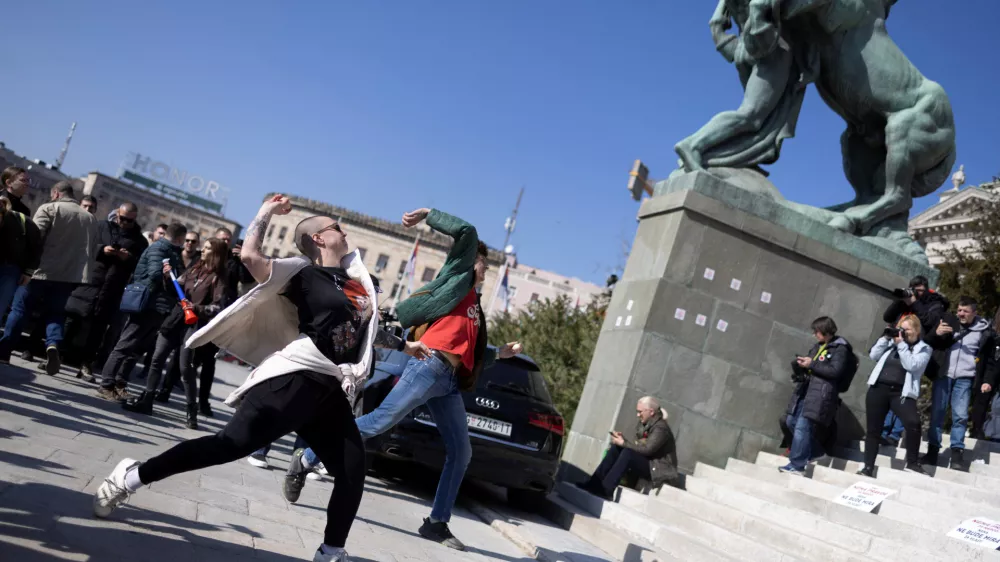 People throw eggs on parliament building during the opening session of this year's spring parliamentary convocation where it is expected to note a resignation of PM Milos Vucevic, in Belgrade, Serbia, March 4, 2025. REUTERS/Djordje Kojadinovic