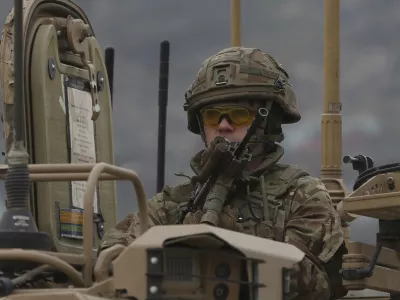 FILE - A British soldier with NATO-led Resolute Support Mission forces arrives at the site of an attack in Kabul, Afghanistan, Wednesday, March 25, 2020. The U.K. government said Wednesday it has no plans to introduce conscription, after the head of the British Army said a "citizen army" would be needed to fight a future war with a country like Russia. (AP Photo/Rahmat Gul, File)