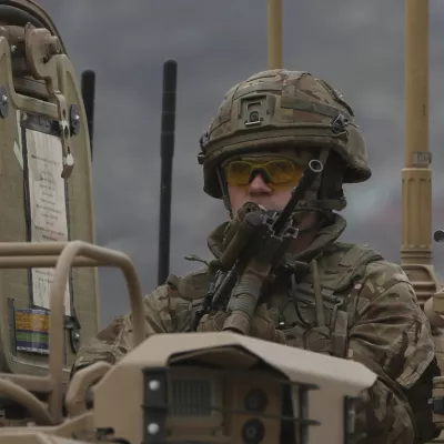 FILE - A British soldier with NATO-led Resolute Support Mission forces arrives at the site of an attack in Kabul, Afghanistan, Wednesday, March 25, 2020. The U.K. government said Wednesday it has no plans to introduce conscription, after the head of the British Army said a "citizen army" would be needed to fight a future war with a country like Russia. (AP Photo/Rahmat Gul, File)