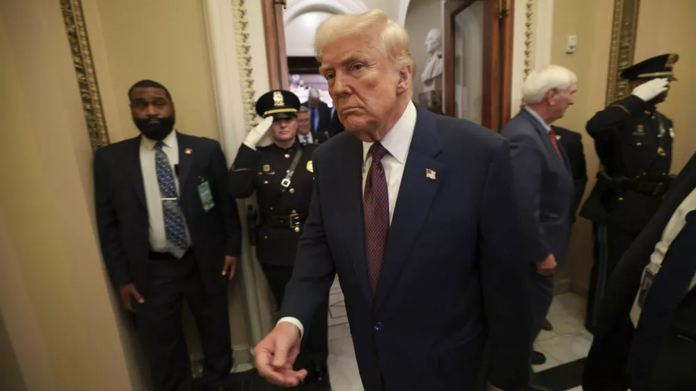 President Donald Trump leaves the chamber after addressing a joint session of Congress at the Capitol in Washington, Tuesday, March 4, 2025. (Win McNamee/Pool Photo via AP)