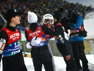 Nordic Skiing - FIS Nordic World Ski Championships - Trondheim, Norway - March 5, 2025 Slovenia's Anze Lanisek and Slovenia's Domen Prevc react during the mixed team large hill HS138 second round REUTERS/Kai Pfaffenbach