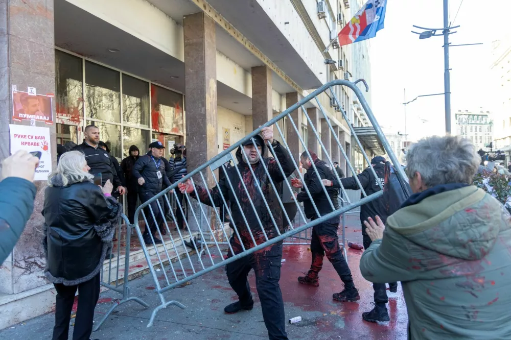 Belgrade City Hall security officials clash with people during a protest in Belgrade, Serbia, March 6, 2025. REUTERS/Djordje Kojadinovic