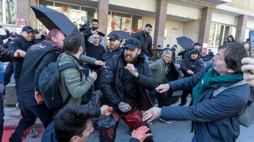 Belgrade City Hall security officials clash with people during the protest in Belgrade, Serbia, March 6, 2025. REUTERS/Djordje Kojadinovic