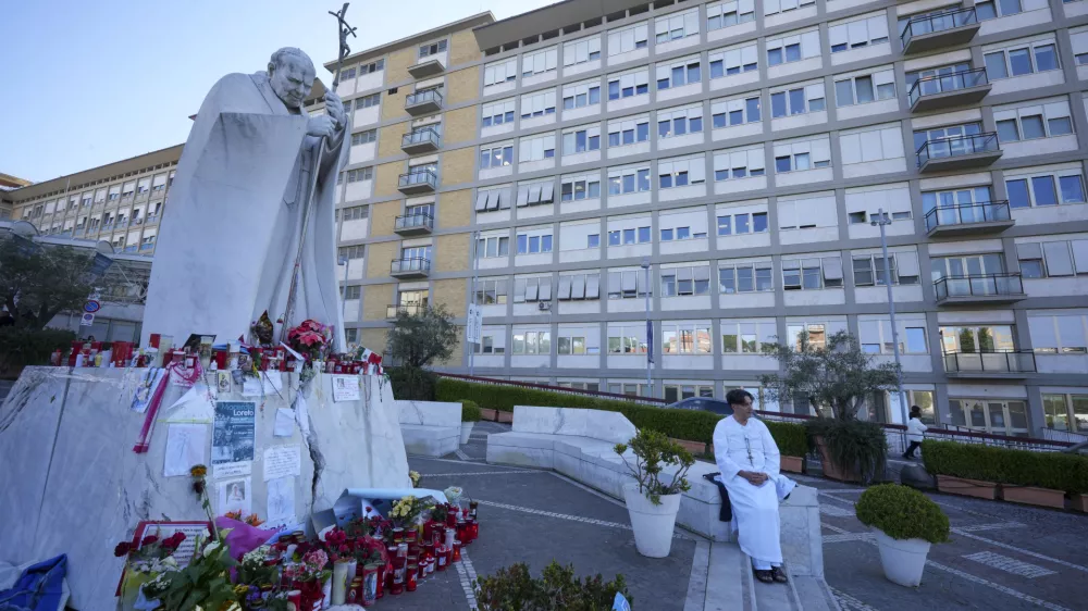 A man prays for Pope Francis in front of the Agostino Gemelli Polyclinic, in Rome, Thursday, March 6, 2025, where the Pontiff is hospitalized since Feb. 14. (AP Photo/Andrew Medichini)