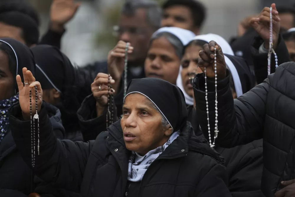 Nuns pray for Pope Francis in front of the Agostino Gemelli Polyclinic, where the Pontiff has been hospitalized since Feb.14, in Rome, Saturday, March 1, 2025. (AP Photo/Kirsty Wigglesworth)