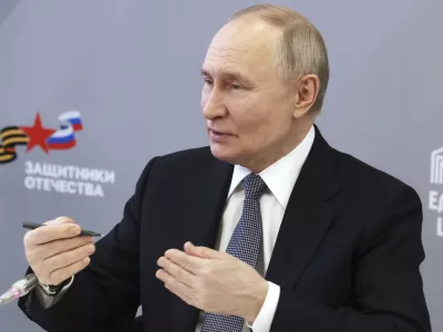 Russian President Vladimir Putin speaks with workers and wards of The Defenders of the Fatherland Foundation in Moscow, Russia, Thursday, March 6, 2025. (Mikhail Metzel, Sputnik, Kremlin Pool Photo via AP)