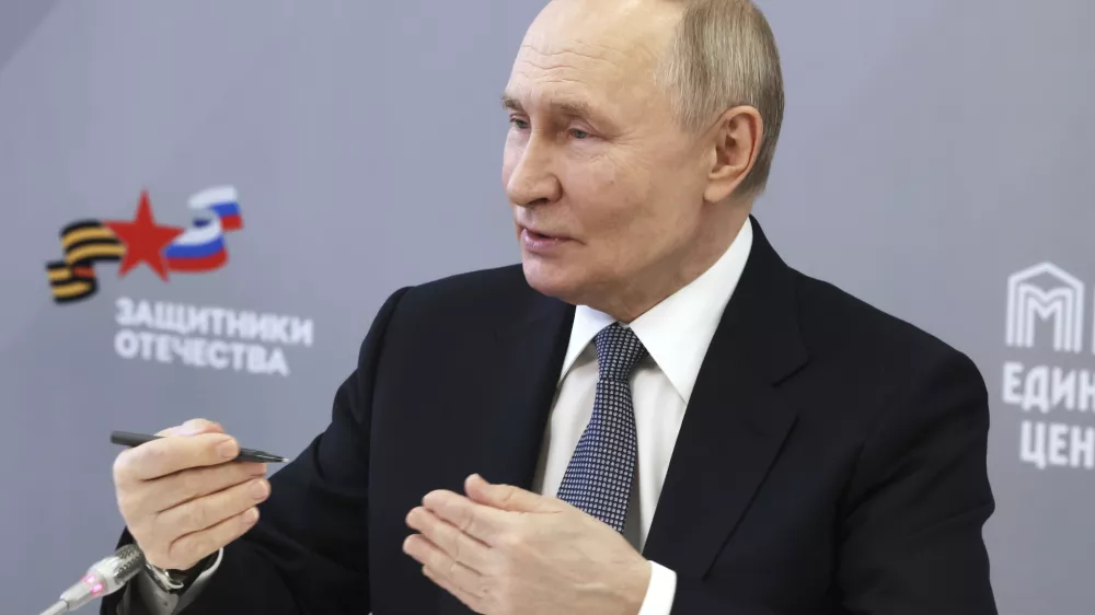 Russian President Vladimir Putin speaks with workers and wards of The Defenders of the Fatherland Foundation in Moscow, Russia, Thursday, March 6, 2025. (Mikhail Metzel, Sputnik, Kremlin Pool Photo via AP)