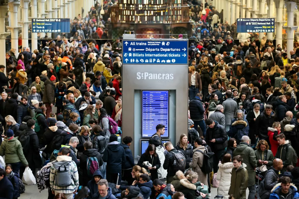 Passengers gather at the departure gates of the Eurostar terminal at St Pancras International Station after the services are cancelled due to a flooded tunnel, in London, Britain, December 30, 2023. REUTERS/Belinda Jiao